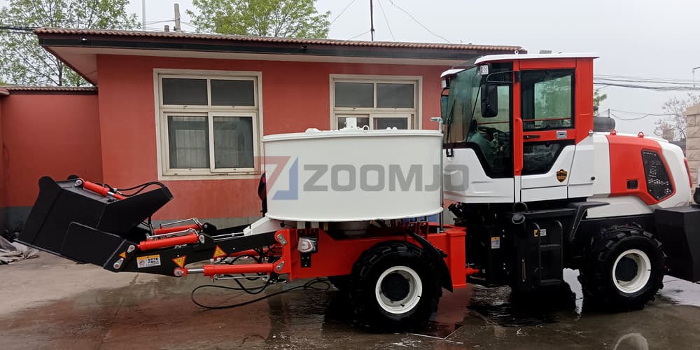 Self-loading concrete mixer